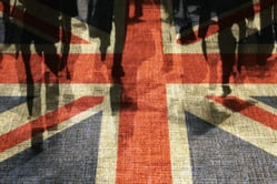 Conceptual image of shoppers overlaid onto UK flag.
